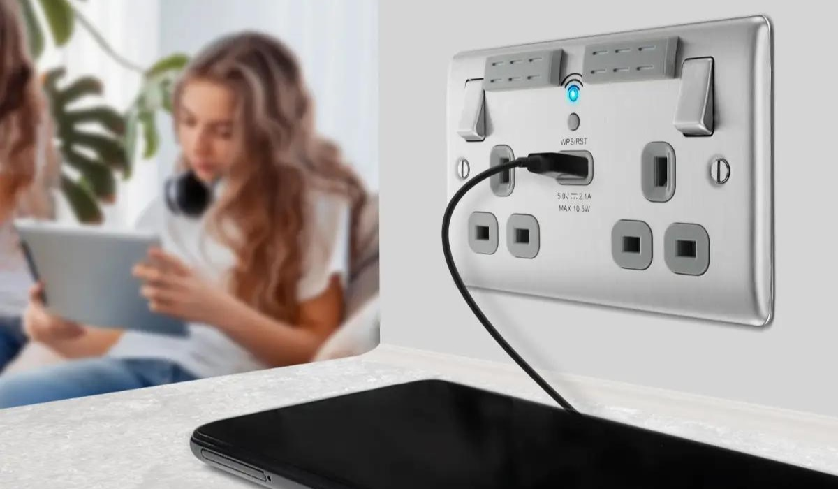 Extender plug socket on wall charging a phone - match decor