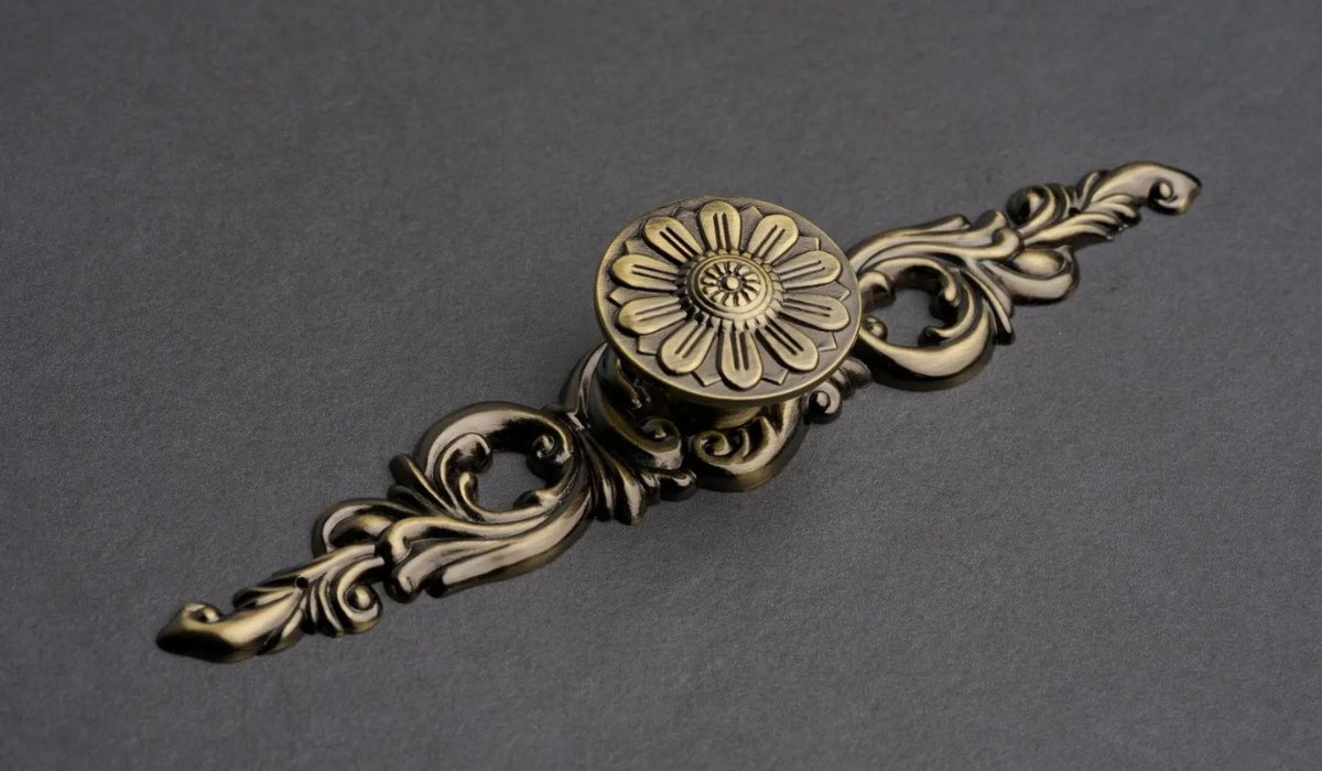 Baroque-style bathroom cabinet handle - decorative with high detail - antique brass