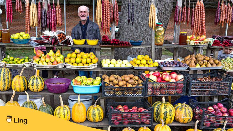 Georgian man who sells fruits and local desserts of churchkhela
