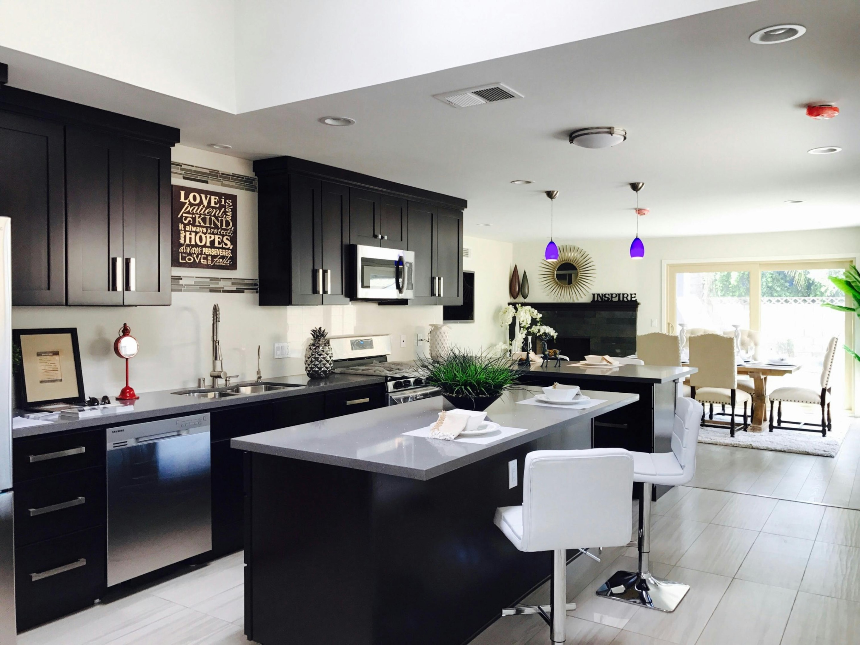 Luxury kitchen design with custom island, quartz countertops, and recessed lighting.