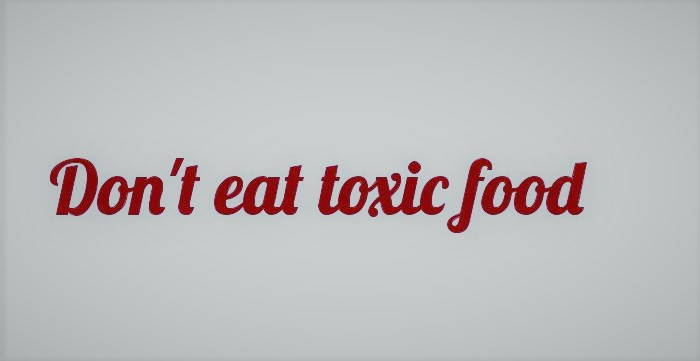 A quote is written with red text on plain white background- " Don't eat toxic food."
