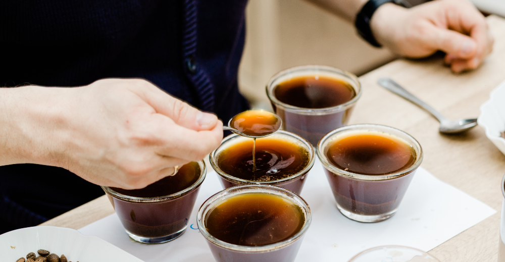 man tasting coffee flavors