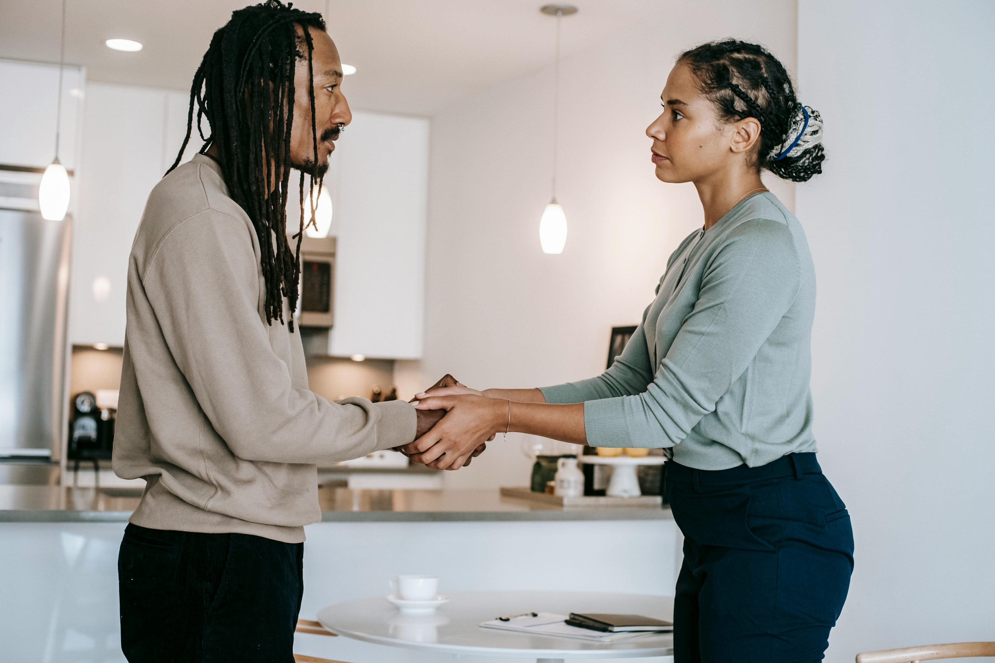 Real estate investor converses with beneficiary looking to sell property.