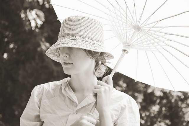 A vintage photo of a woman wearing a hat