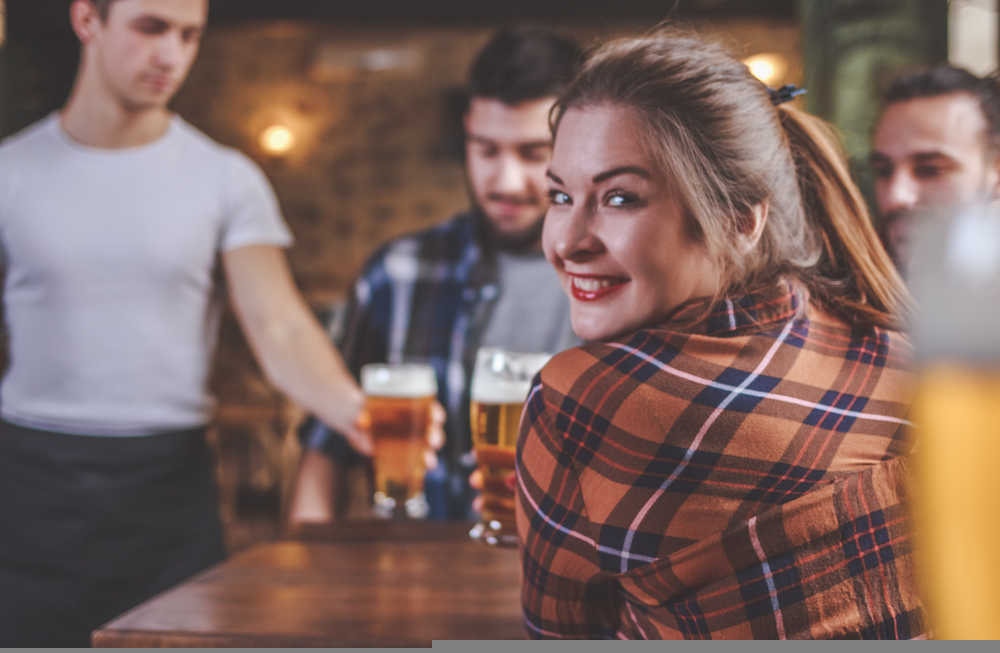 Woman smiling with pint
