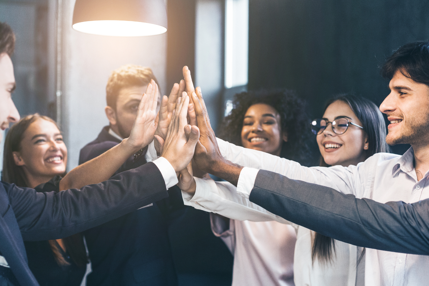 A multicultural remote team celebrating a project milestone together.