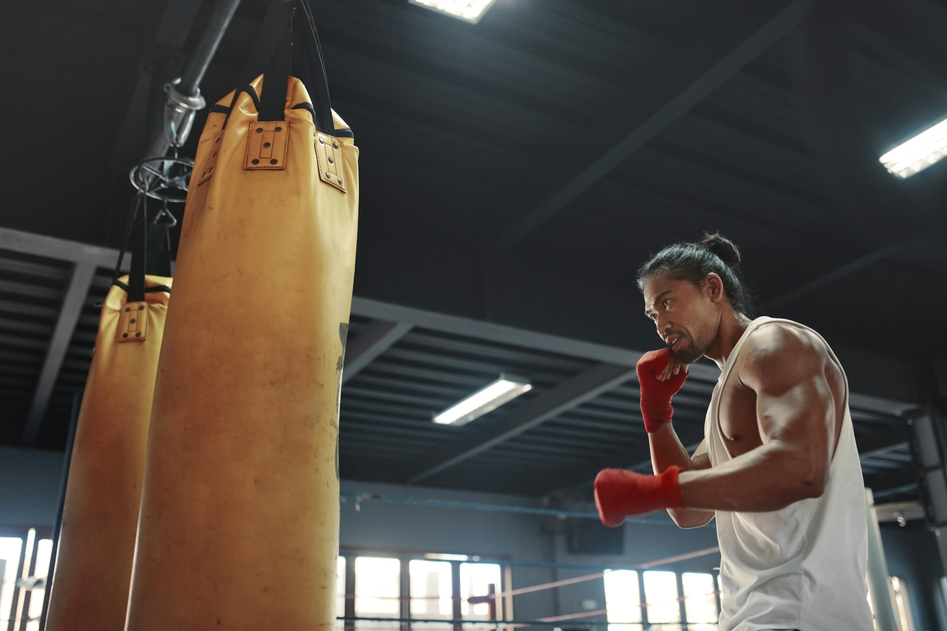 A man with testosterone in the gym punching a punching bag - https://unsplash.com/photos/gym-man-near-punching-bag-asian-sportsman-going-to-knock-boxing-equipment-at-fitness-center-portrait-of-sexy-handsome-guy-with-strong-healthy-muscular-body-AOhg4d46KRw