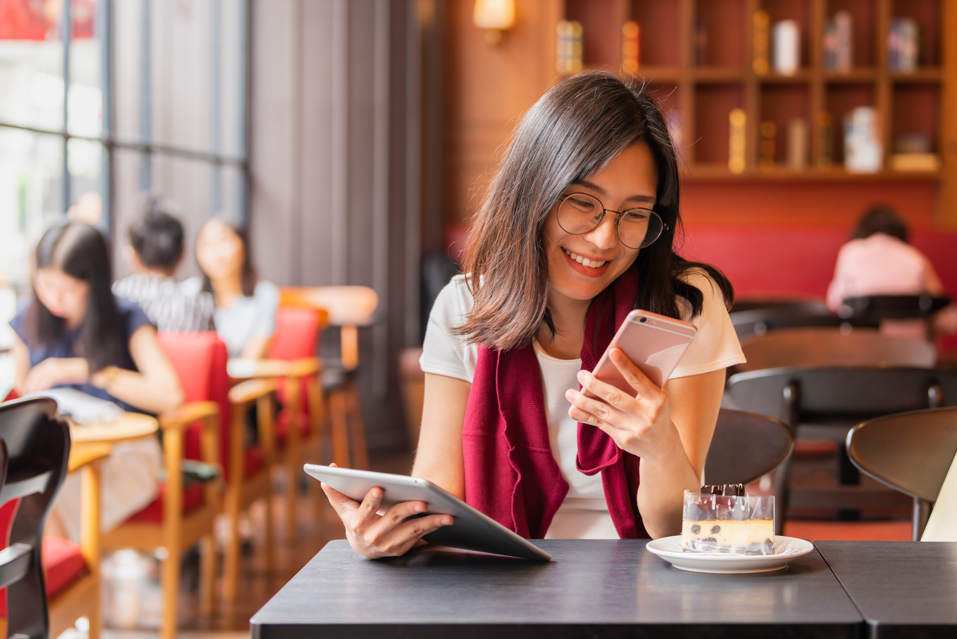 Woman using tablet and mobile