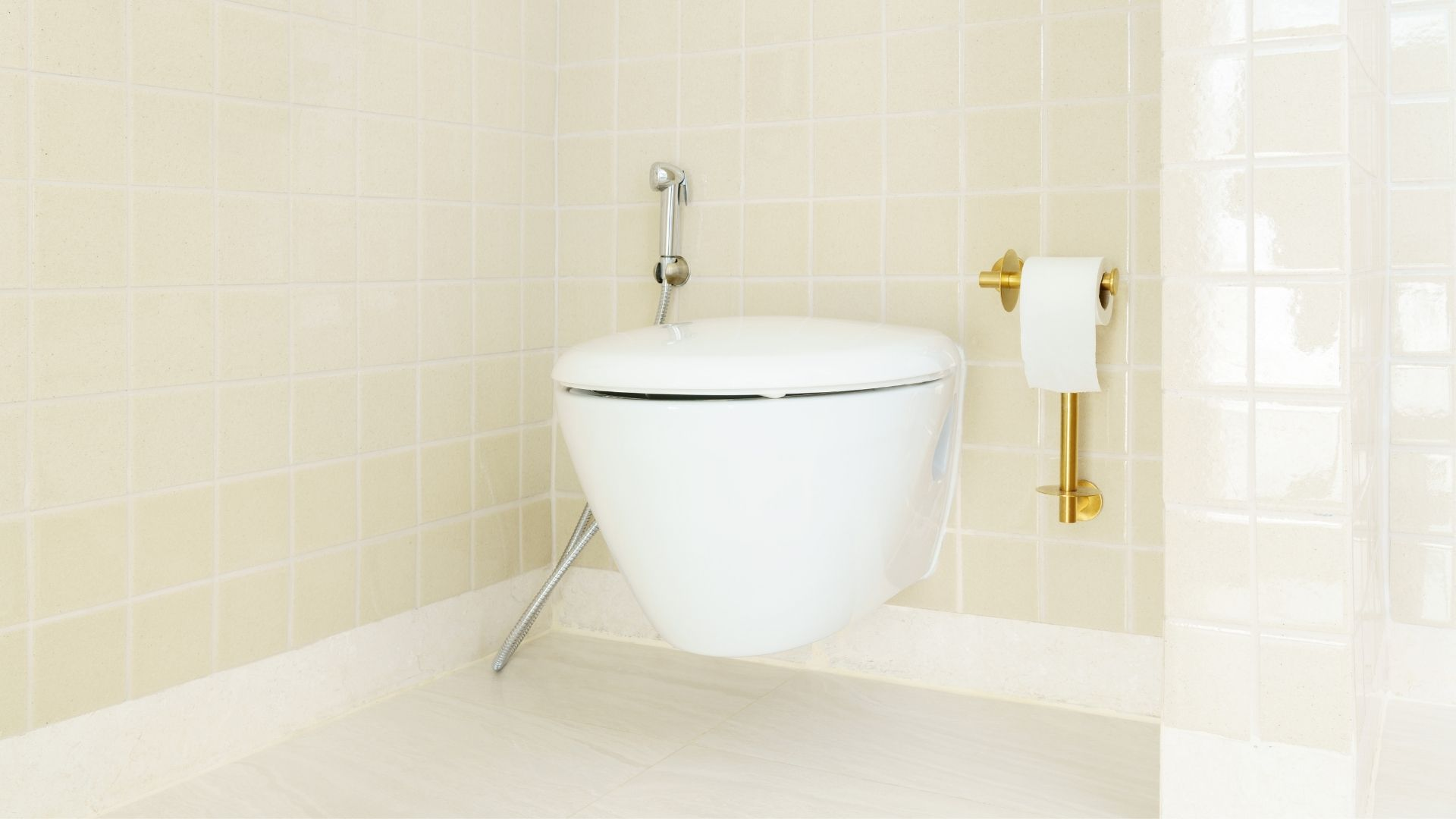 Beige bathroom with floating toilet