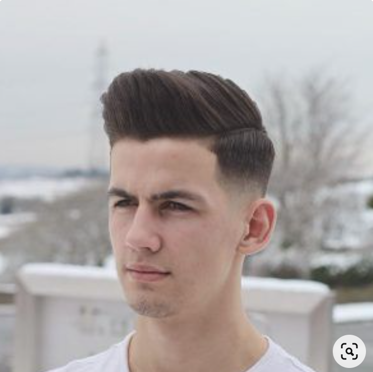 young male with pompadour haircut
