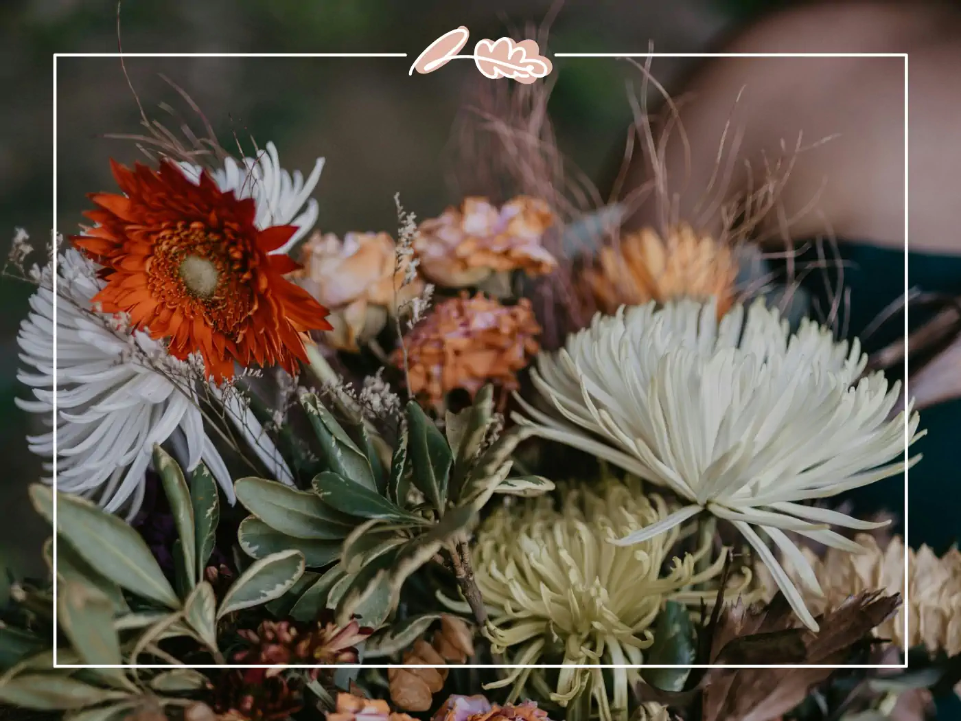 Rustic bouquet with orange, white, and earthy-toned flowers. Fabulous Flowers and Gifts