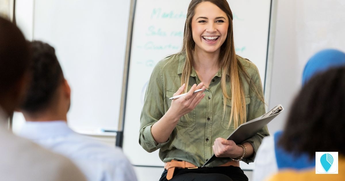 a manager training her employees in a lecture setting