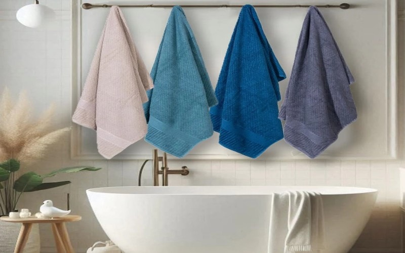 Bamboo towels hanging over a bathtub