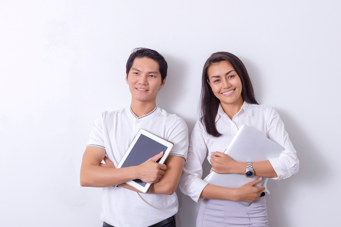 Two Filipino professionals with digital tools, representing young job seekers in Manila and Cebu.