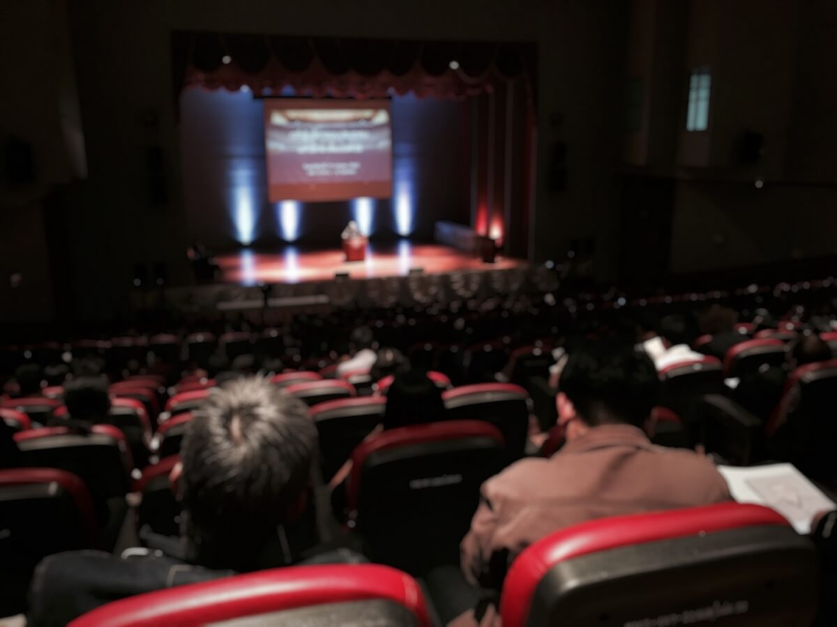 Audience attends a live real estate seminar