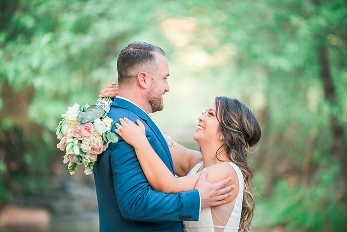 A wedding photographer capturing a couple on their wedding day.