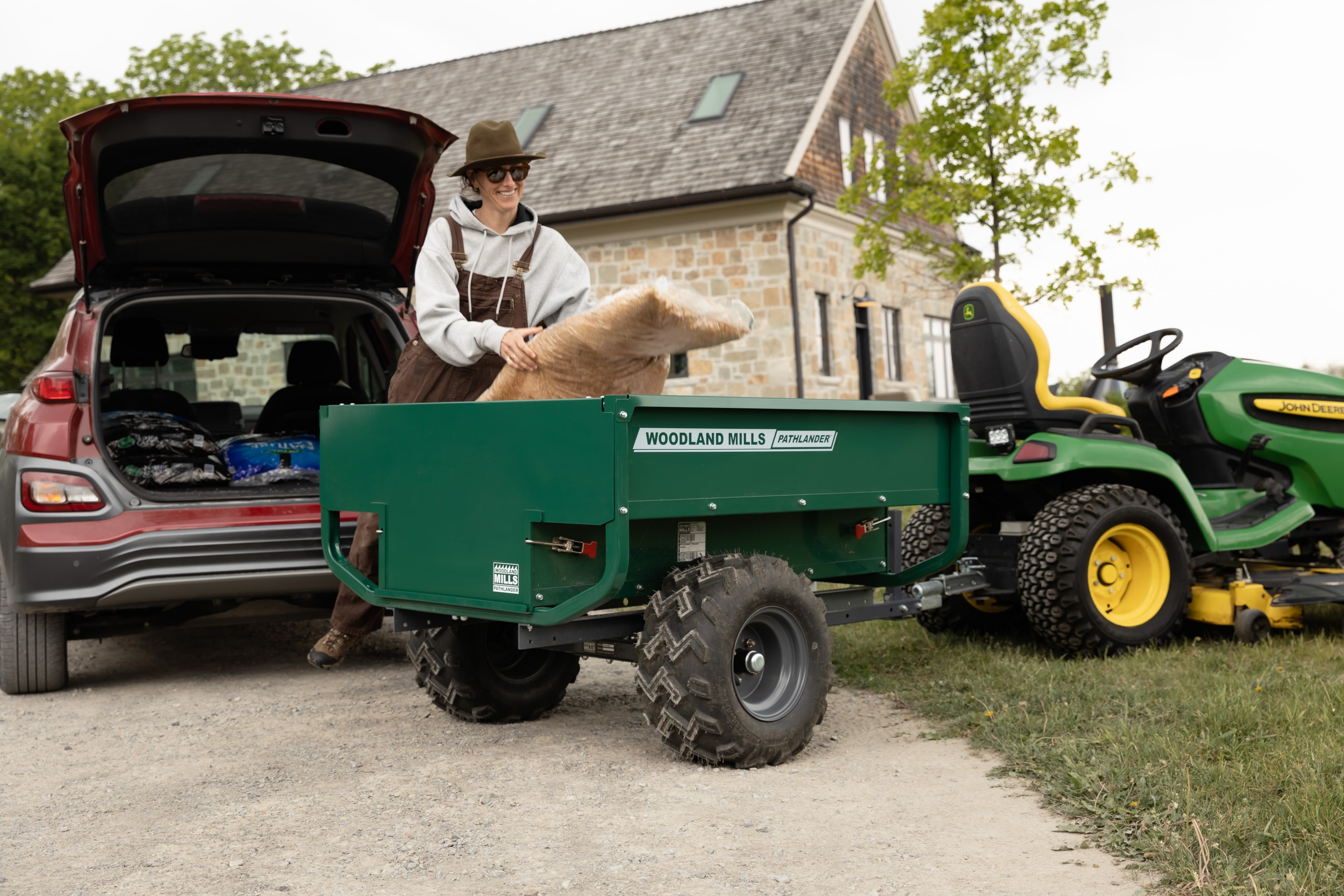 A Woodland Mills Pathlander being loaded in an enclosed bed, for when you want security for your loads. 