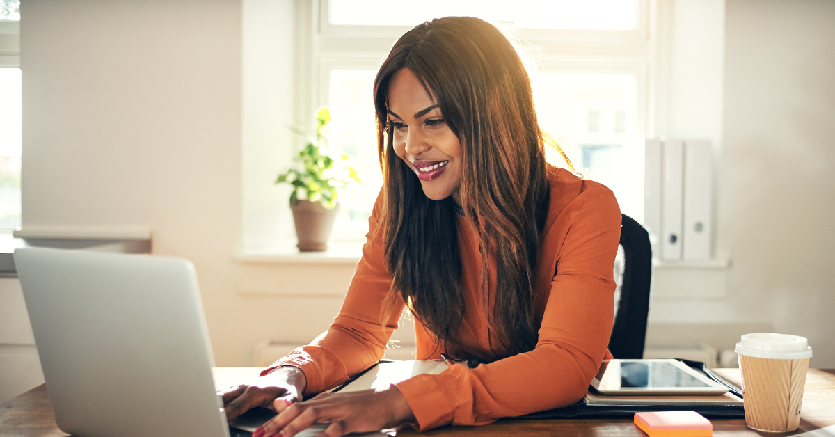 A woman at her laptop knowing How does Onlyfans show up on tax returns?