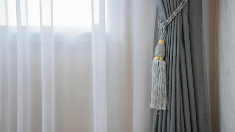 A viscose curtain with a tassel hanging from it