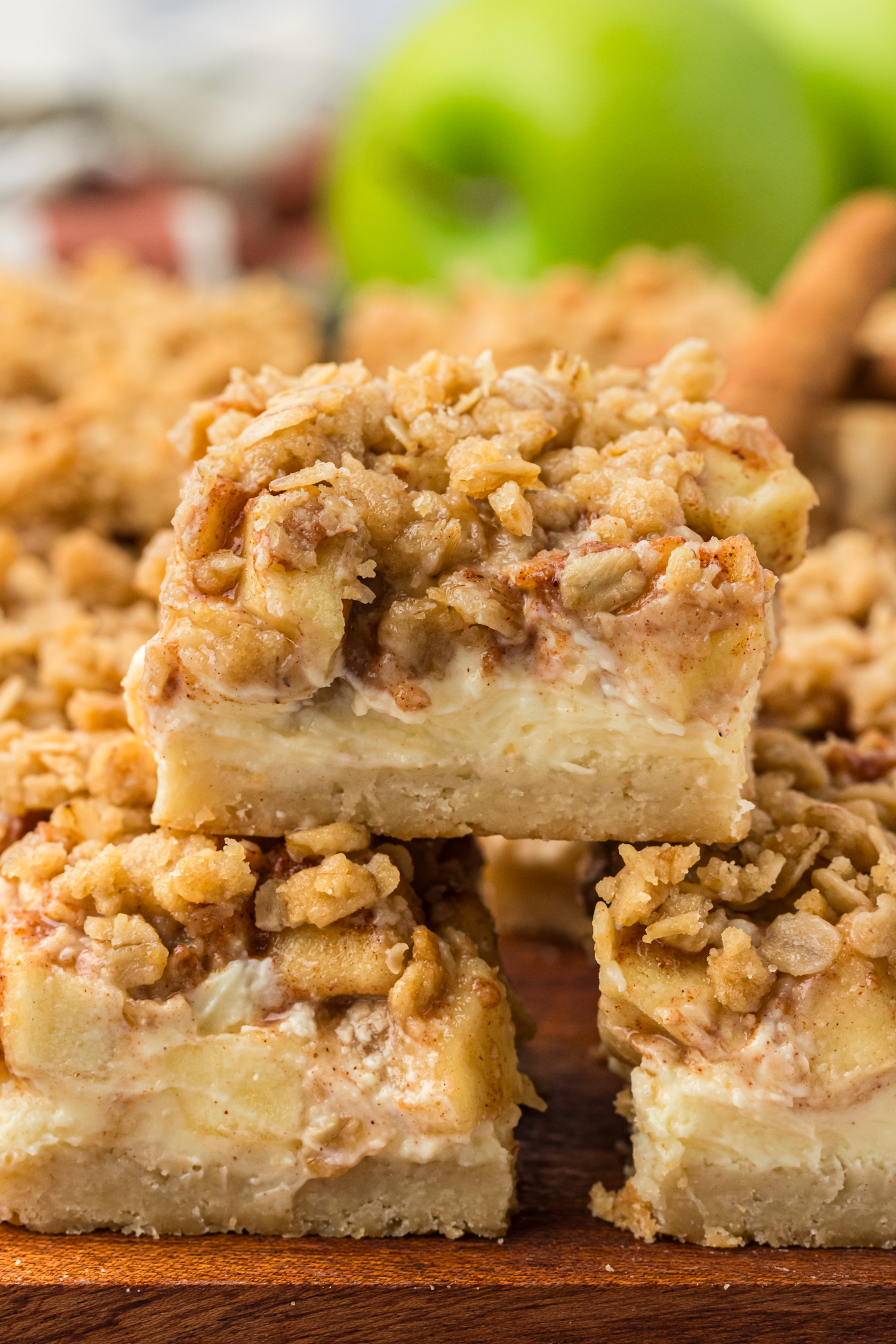 caramel apple cheesecake bar stacked on top more bars