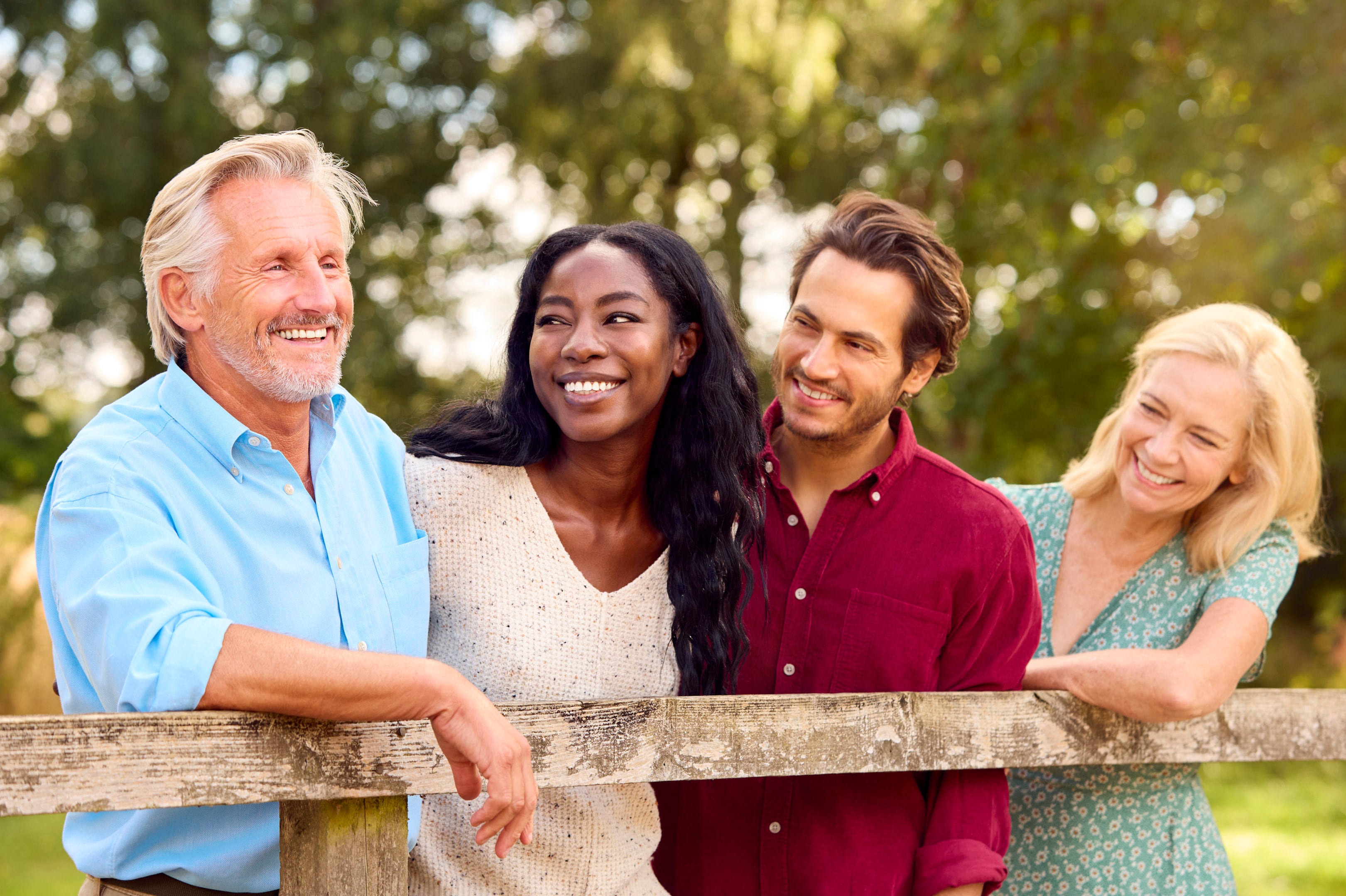 a smiling family who all benefited from Mahogany Oral Surgery's professional staff and friendly environment