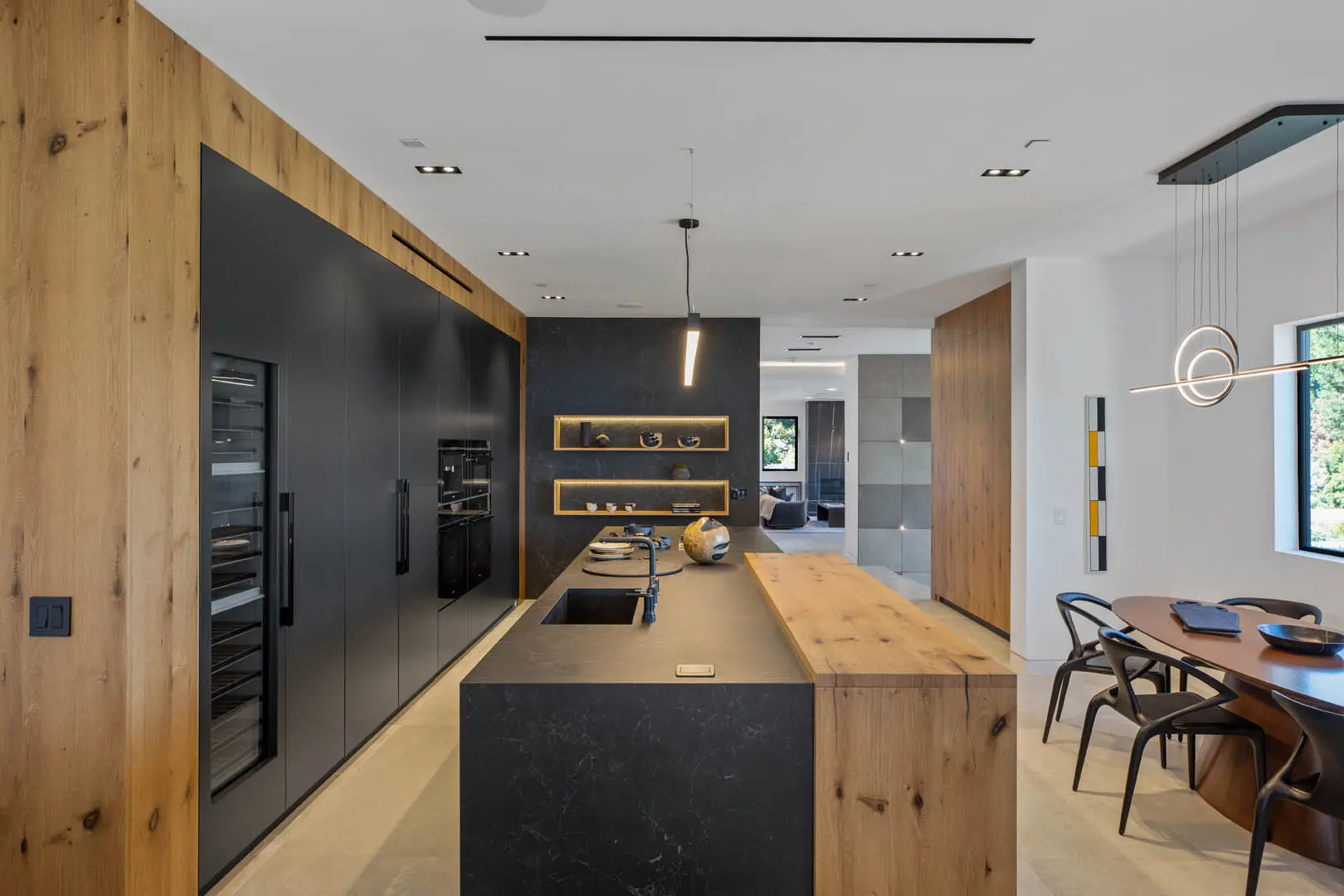 Kitchen with both black and wood colors