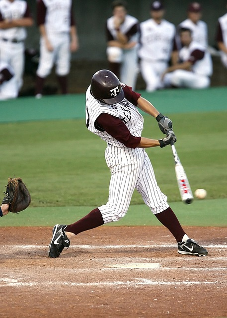 baseball player making solid opposite field contact with the ball