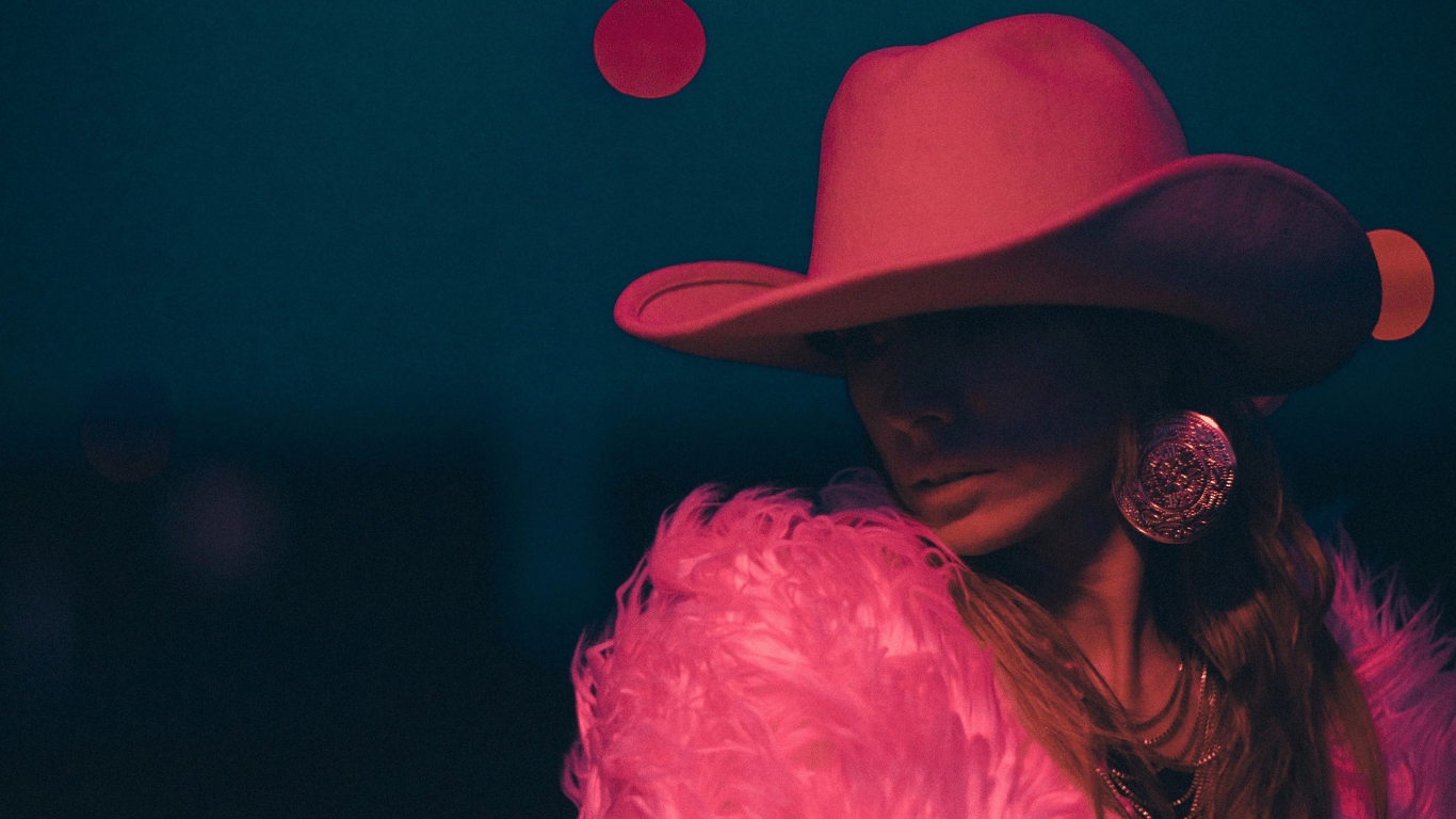 woman in a pink gambler cowboy hat