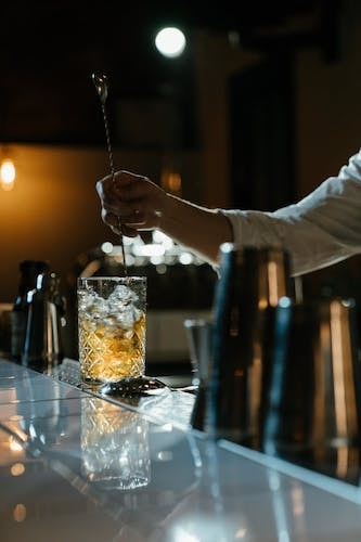 Pictures of a passionate bartender mixing a drink