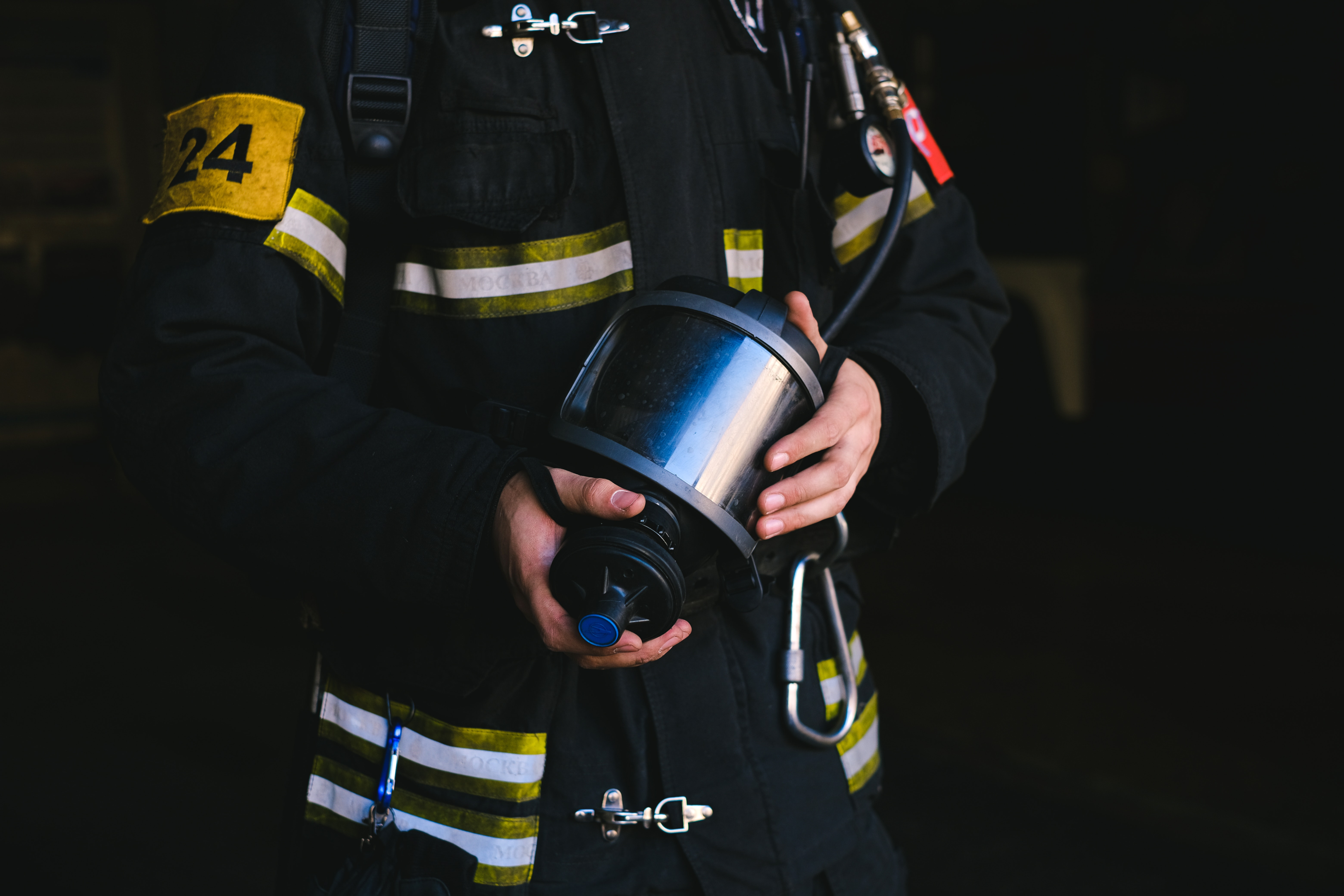 firefighter holding a gas mask