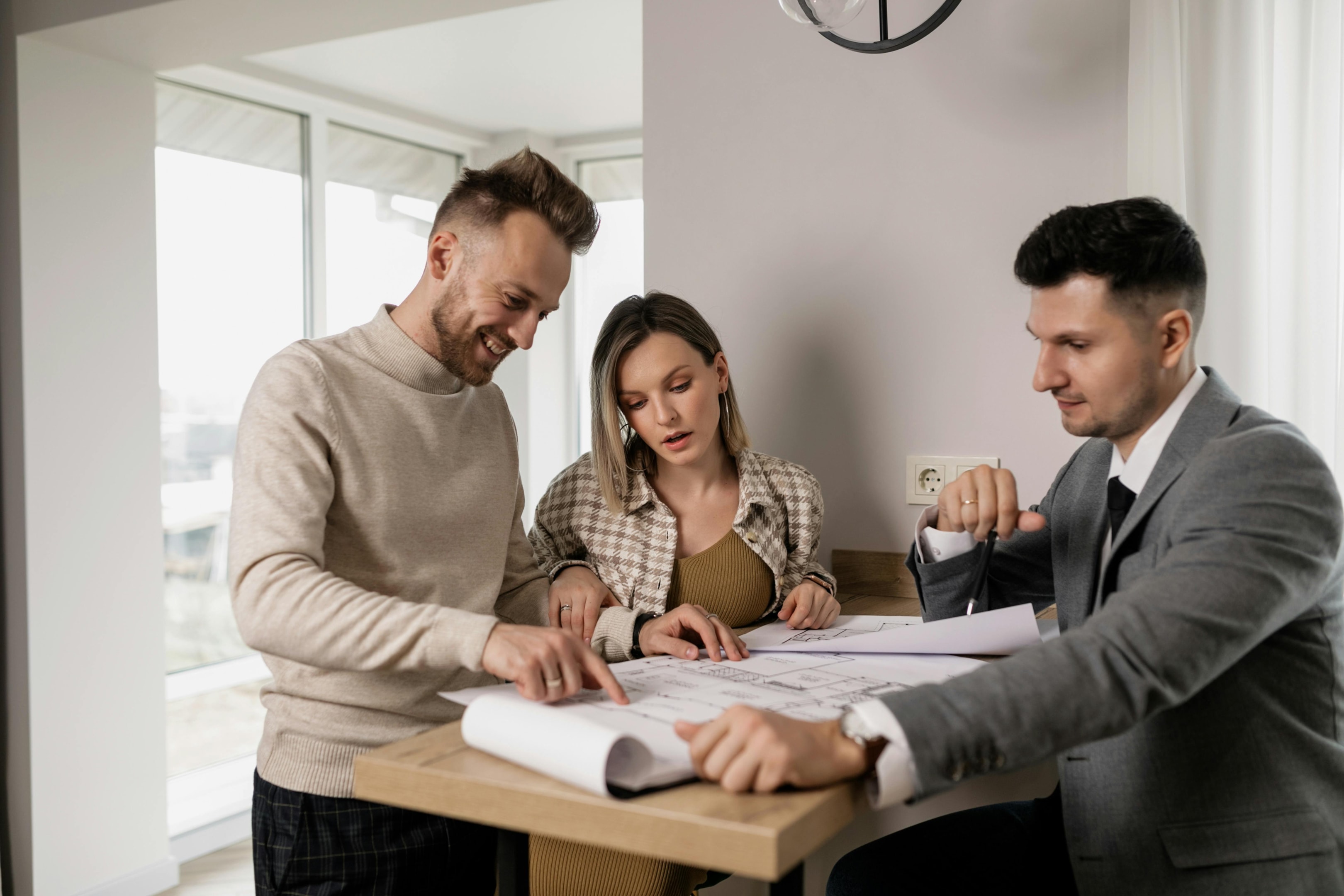 Real estate investor reviews documents with beneficiaries of probate property. 