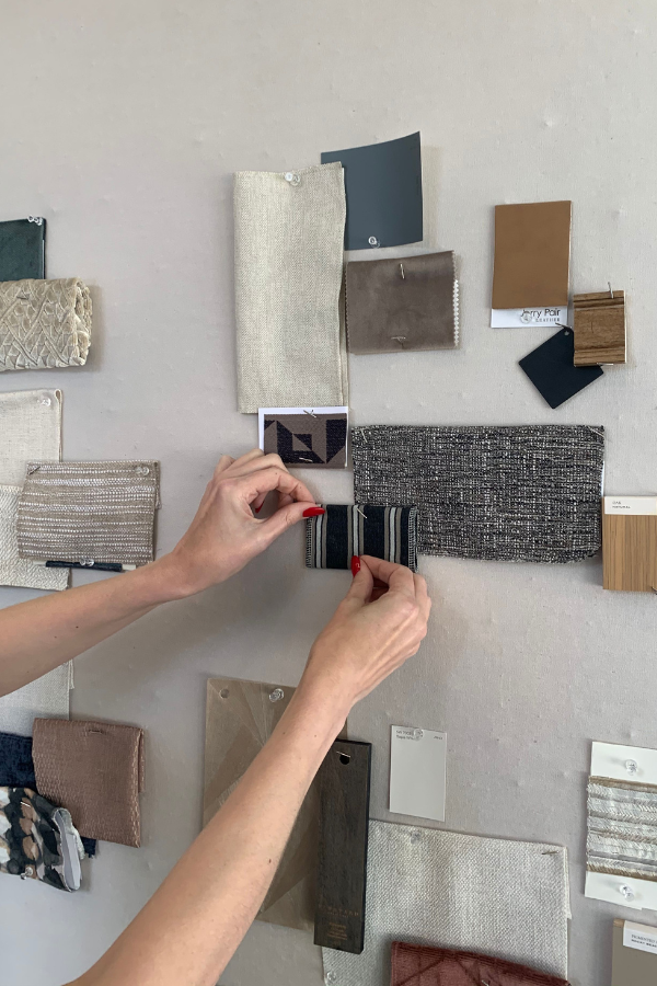 a member of the ludc team pinning samples to a mood board