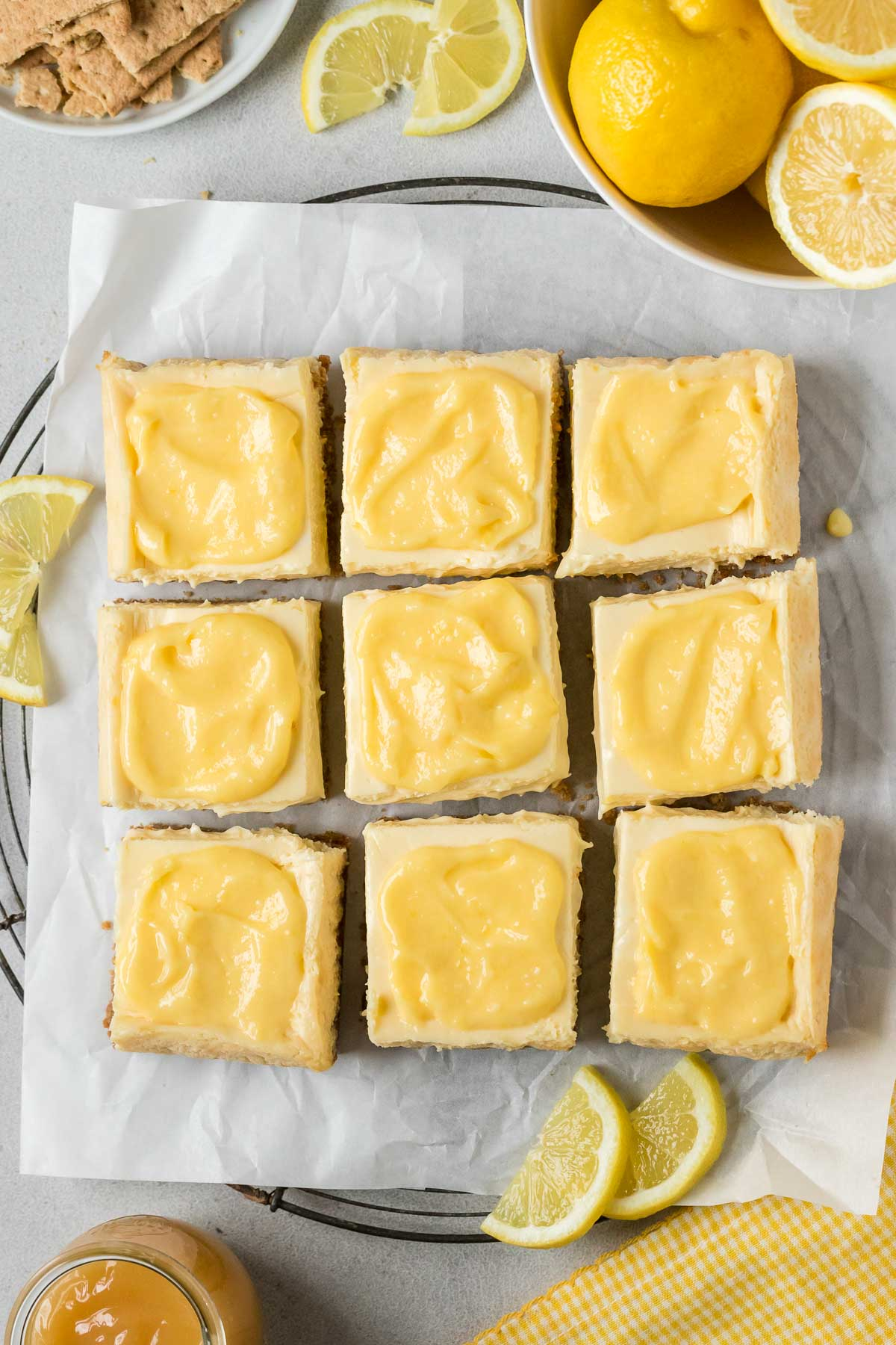 lemon cheesecake bars topped with curd cut into squares