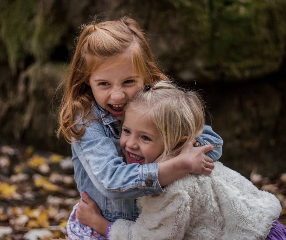 two kids hug