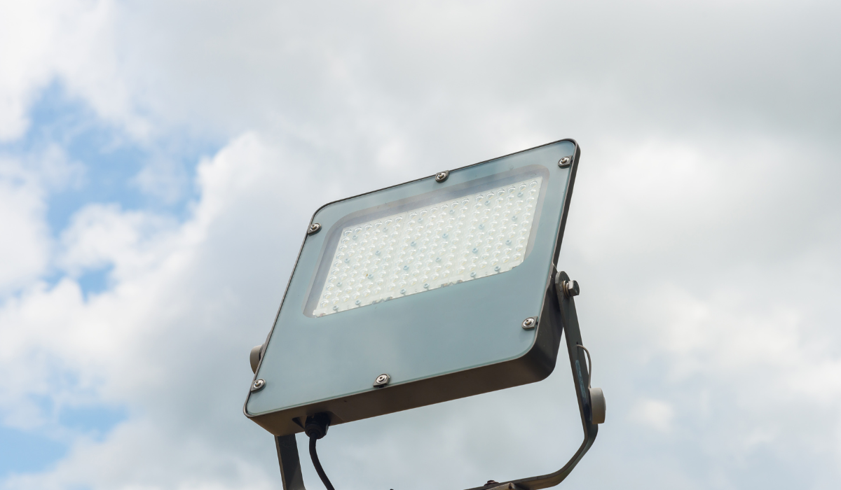 Modern LED flood light - upward facing - against sky background
