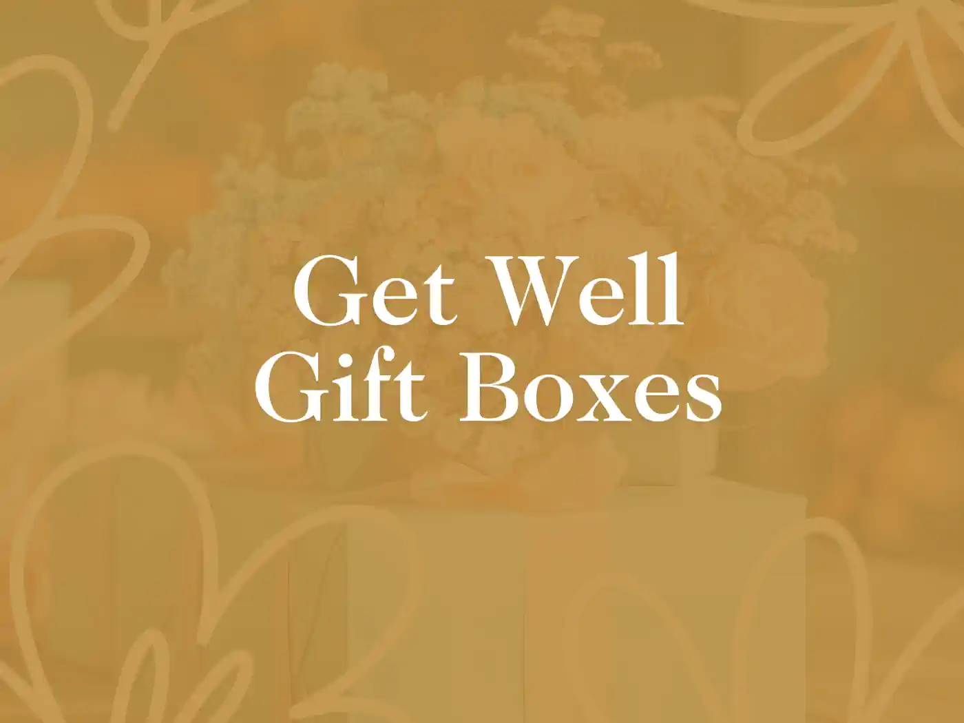 Alt tag: "Promotional image with 'Get Well Gift Boxes' text, featuring a blurred background of a floral arrangement in warm tones, symbolizing care and comfort. Delivered with Heart. Fabulous Flowers and Gifts.