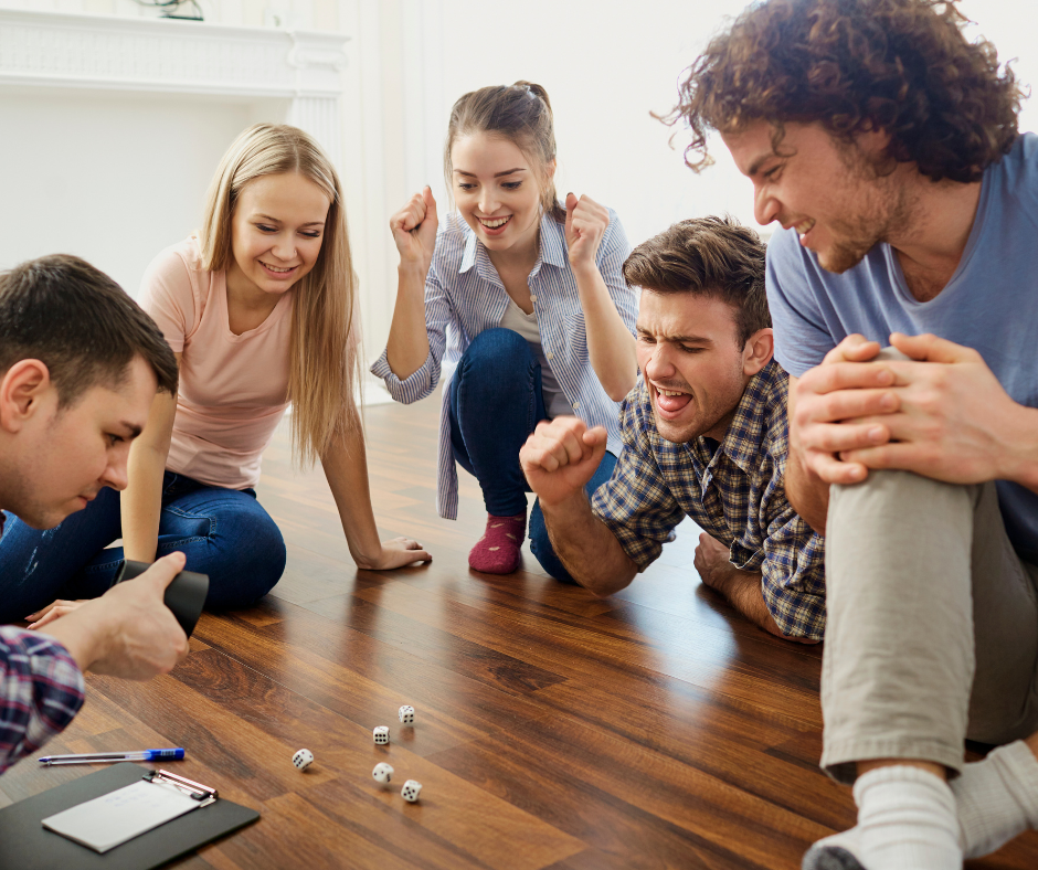 A group of friends playing board games and having a good time without drinking alcohol