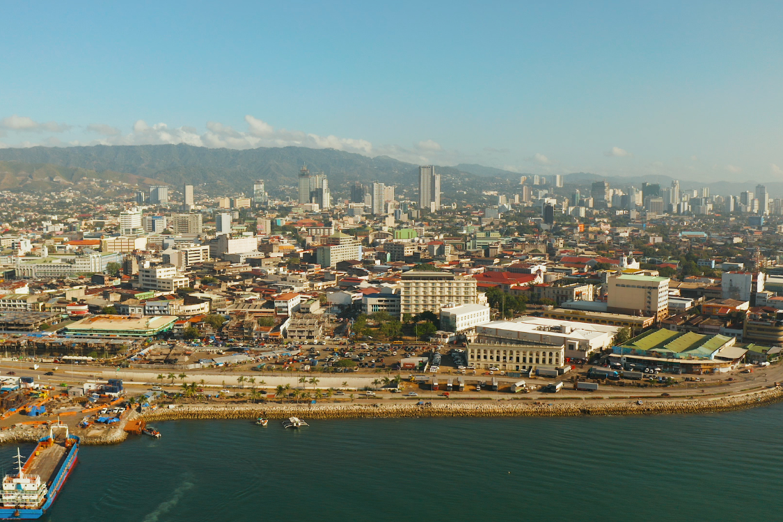 Coastal view of Cebu City showing urban skyline and surrounding mountains