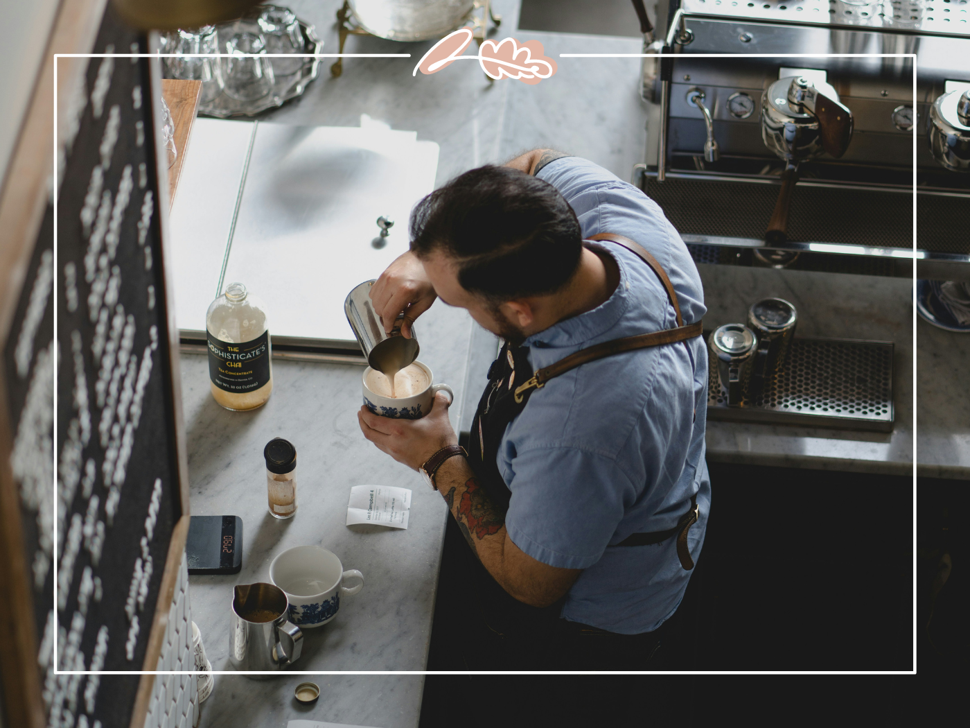 Barista pouring milk into a coffee cup in a coffee shop. Fabulous Flowers and Gifts