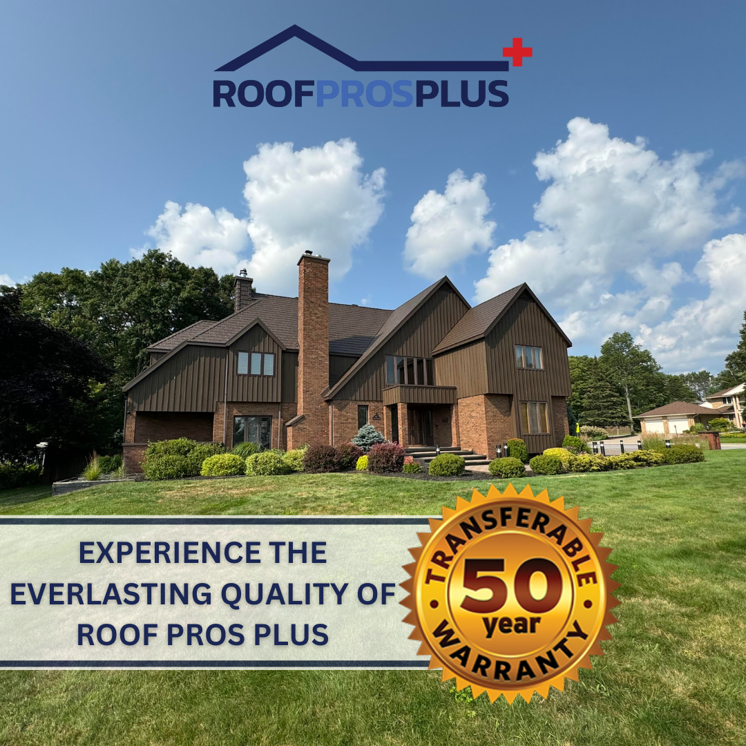 Large brick-and-wood house with a metal roof, under a clear blue sky, surrounded by greenery. "ROOF PROS PLUS" logo above the house, with text underneath the house stating a 50-year transferable warranty.