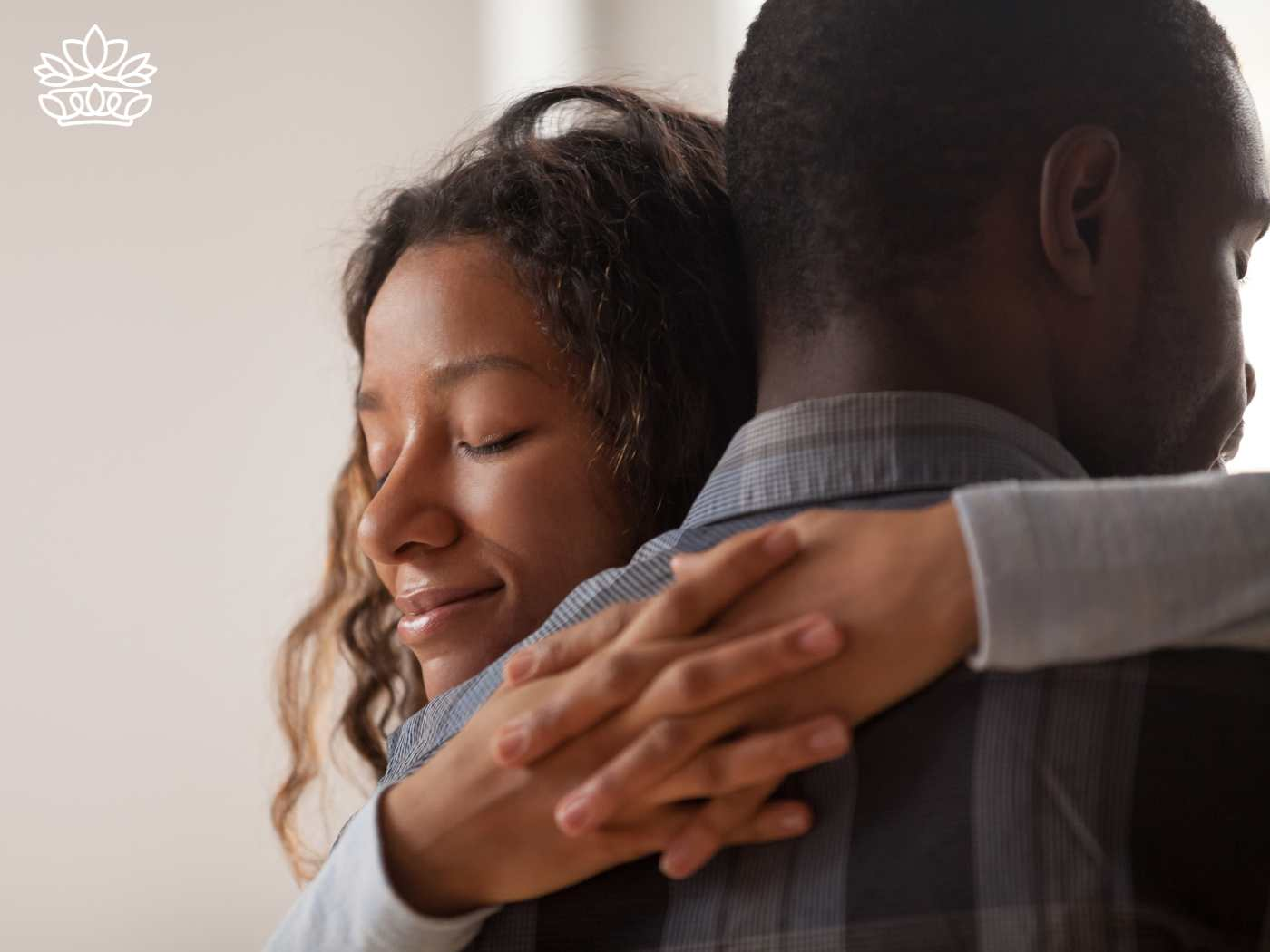 A woman warmly embracing her husband, representing the Gift Boxes for Husband Collection - Gifts that match every road trip and loved by Amazon reviewers, of course - Fabulous Flowers and Gifts