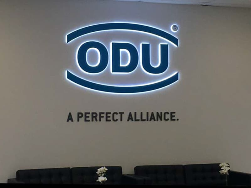 This acrylic office lobby sign for ODU in Camarillo uses a halo lit channel letters and 3D letters.