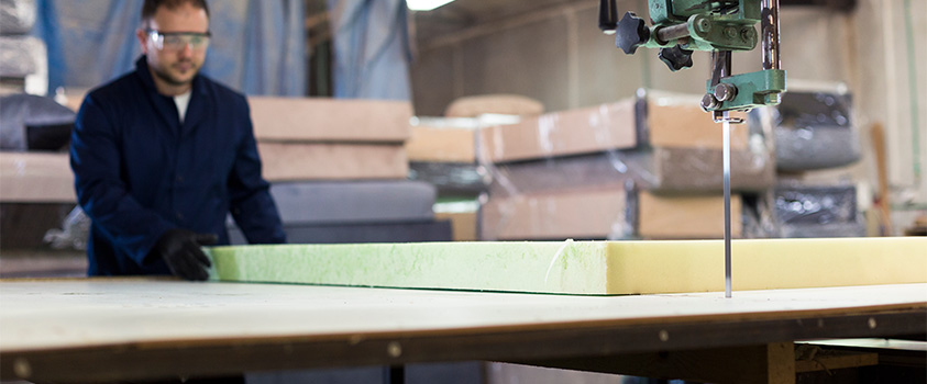 A block of foam is being prepared for cutting with a jigsaw.