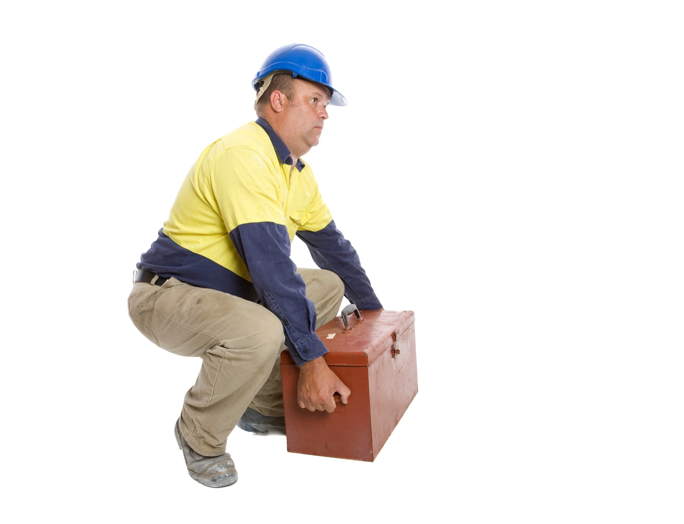 A man in a yellow shirt follows health and safety guidelines to avoid dangerous manual handling practices