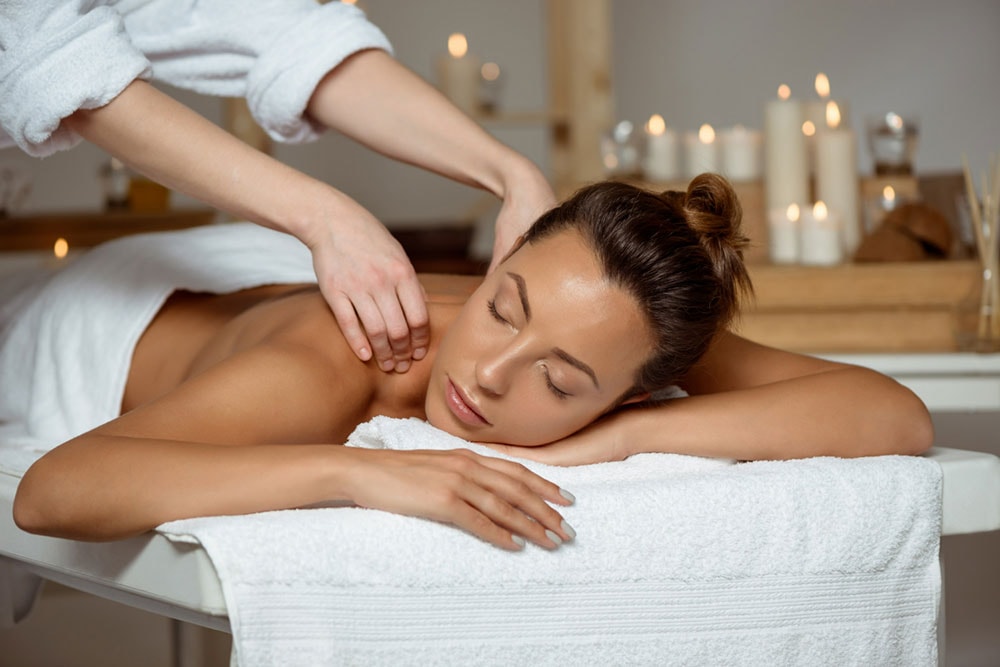 An illustration showing a massage therapy session, highlighting insurance cover massage.