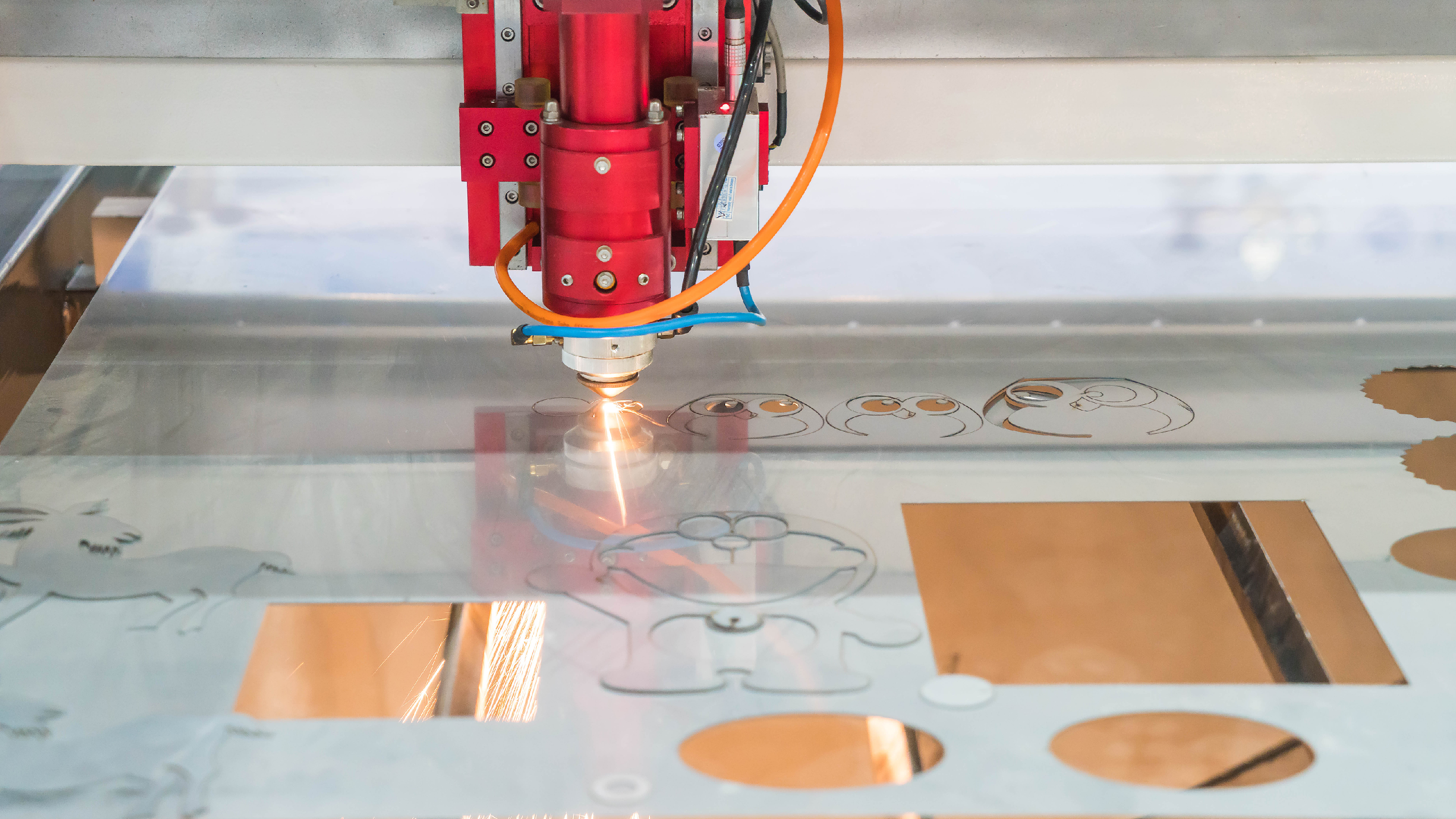 laser cutting machine cutting artistic design on metal sheet