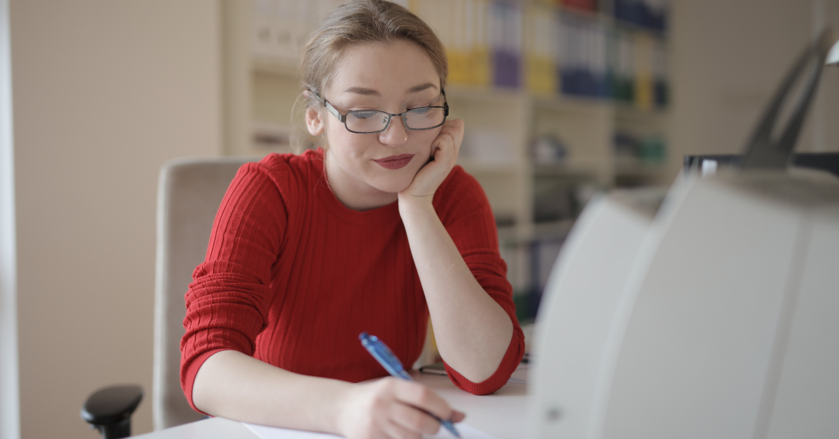 A woman calculating OnlyFans income and preparing her tax return