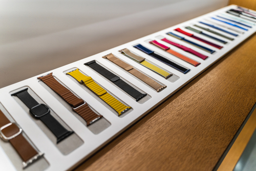 An image showcasing various apple watch bands made of different materials including leather, stainless steel, and silicone.