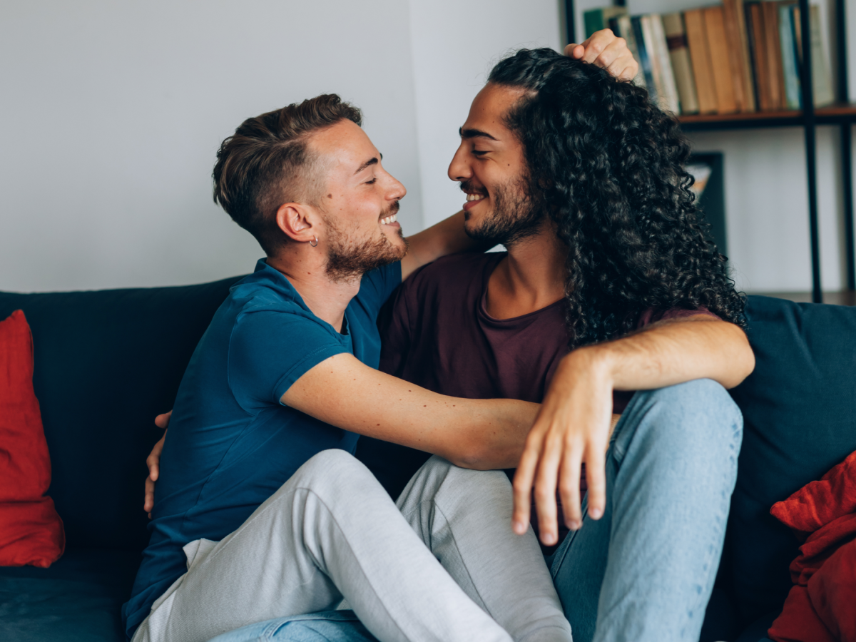 Image depicting a neatly arranged shared living space with elements of personal belongings from two individuals, symbolizing the concept of cohabitation for gay couples in New York City. The room illustrates the process of merging two distinct lives in a single space, providing a visual metaphor for the transition and adjustment involved when moving in together without entering dead bedroom syndrome.