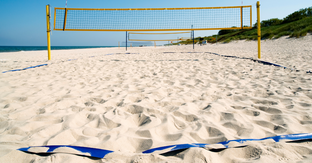 Many outdoor courts that are used for tournaments are already set up like this one, with the volleyball court defined with boundary lines and an official volleyball net already up and installed in the sand.